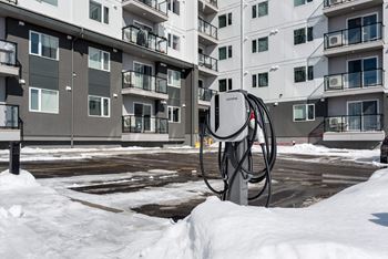 a building with stairs in the snow in front of it